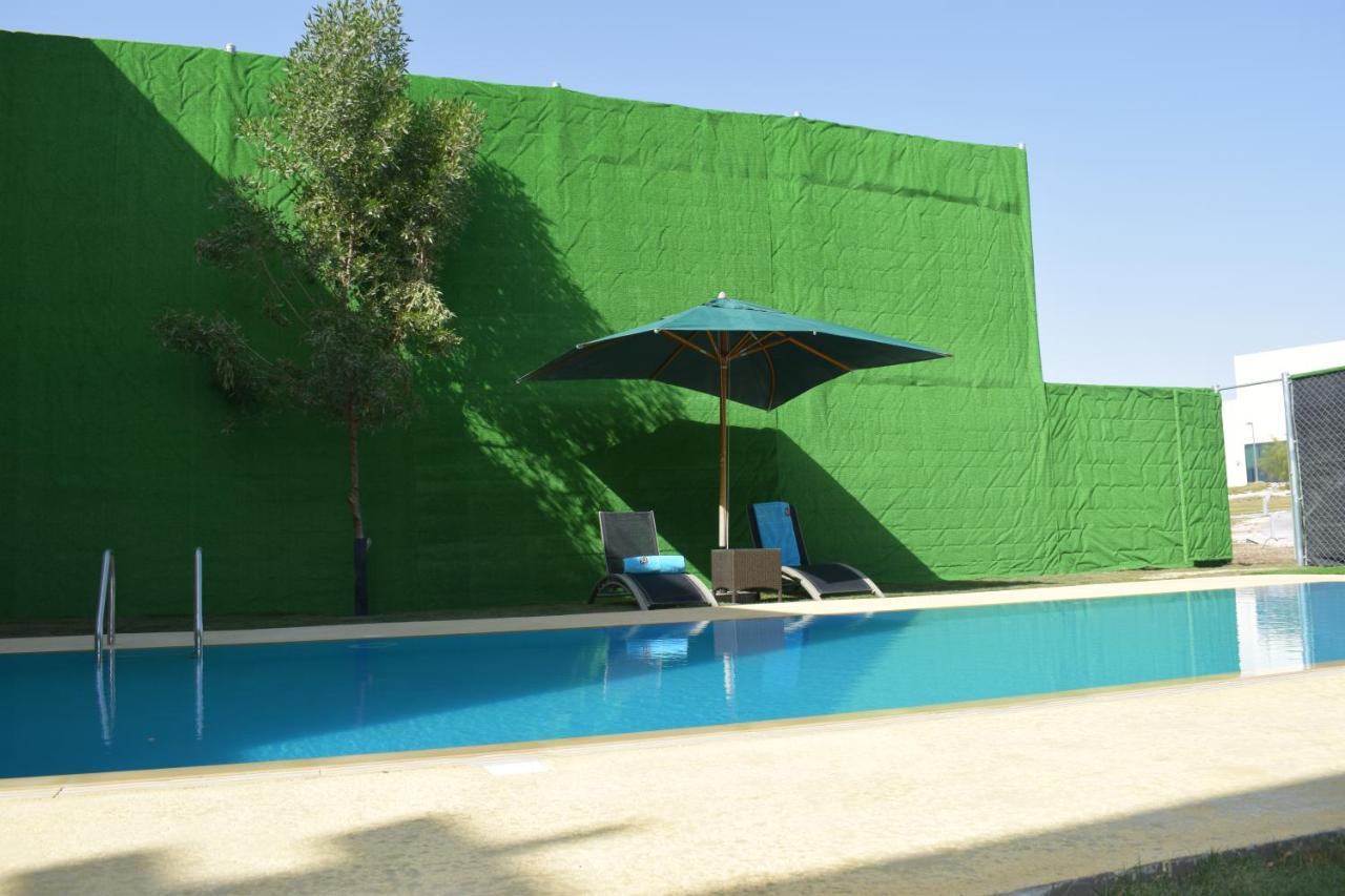 Retaj Salwa Resort & Spa Ad Dawhah Esterno foto A swimming pool in Spain